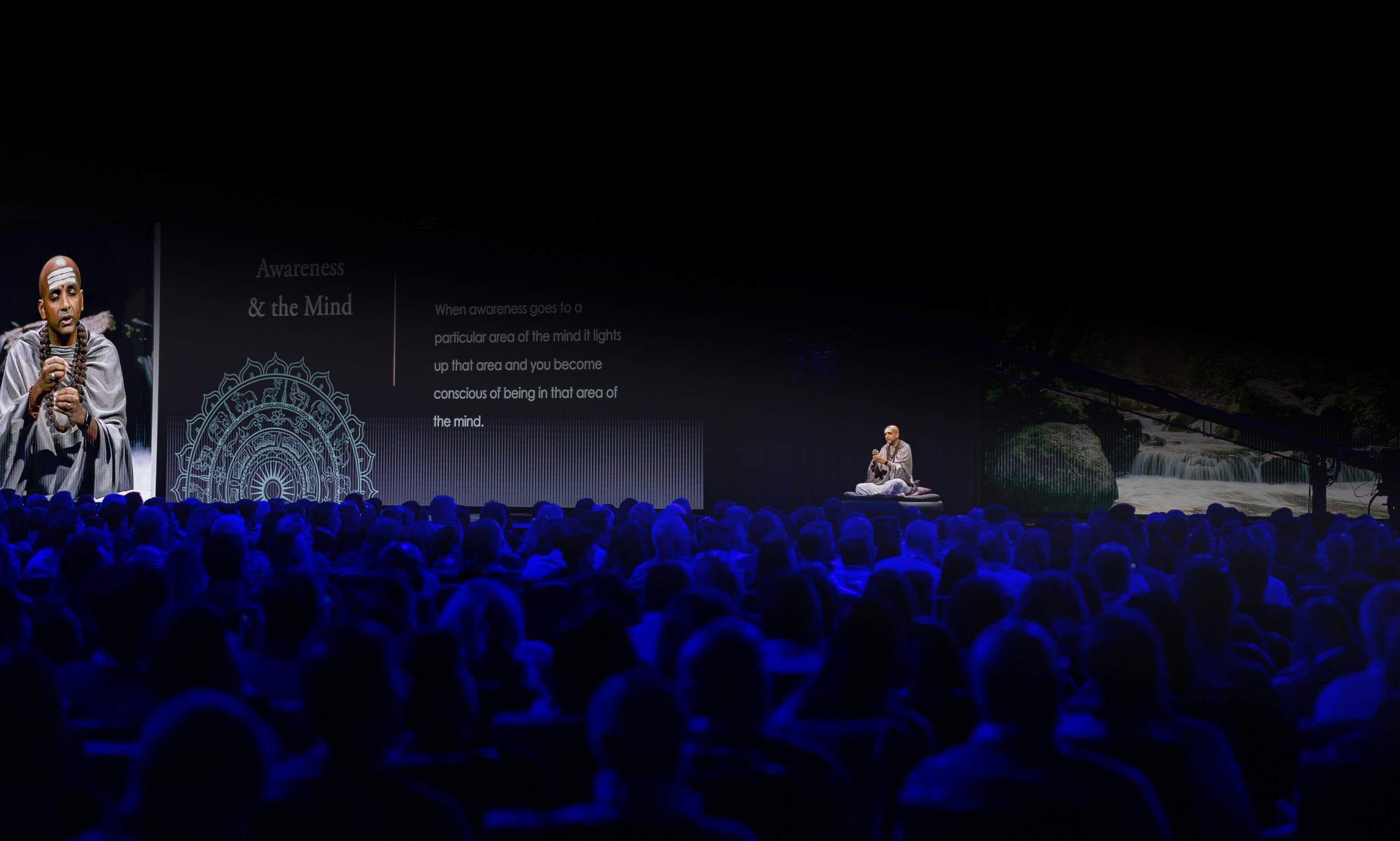 Dandapani speaking in front of a crowd